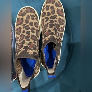 Rothy’s sneakers in leopard print, they are worn but are still in good condition